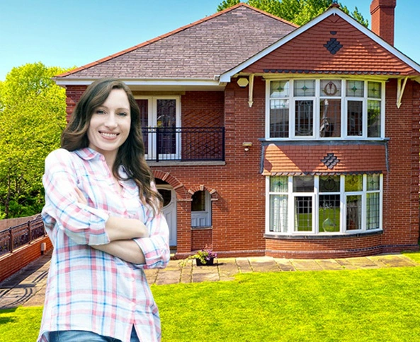 Woman in front of house with clean windows Woman in front of house with clean windows